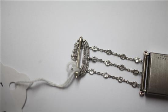 A 1920s rose cut diamond and ruby set staybrite steel Le Coultre lapel watch with diamond set suspension brooch, 55mm.